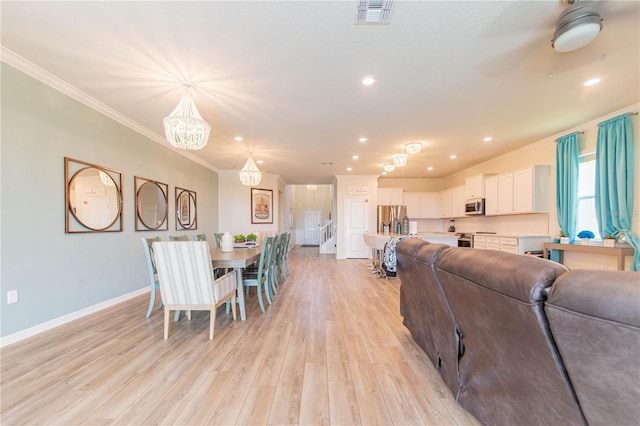 2090 Lelani Cir, Davenport, FL 33897 - dining space featuring ornamental molding, a chandelier, light wood-type flooring, and recessed lighting