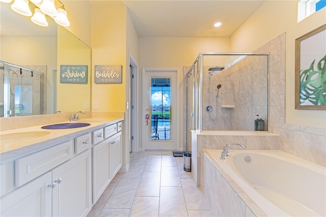 2090 Lelani Cir, Davenport, FL 33897 - bathroom with a stall shower, a garden tub, double vanity, plenty of natural light, and recessed lighting
