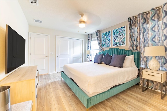 2090 Lelani Cir, Davenport, FL 33897 - bedroom with a closet, light wood-style floors, and ceiling fan