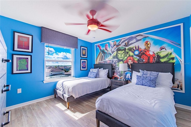 2090 Lelani Cir, Davenport, FL 33897 - bedroom with wood finished floors and ceiling fan