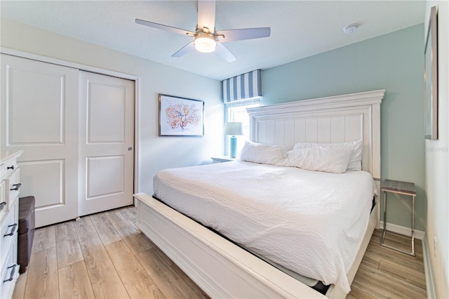 2090 Lelani Cir, Davenport, FL 33897 - bedroom with light wood-style floors, a closet, and a ceiling fan
