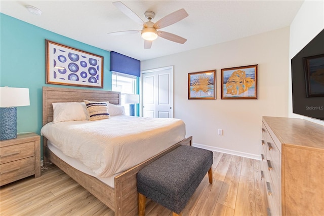 2090 Lelani Cir, Davenport, FL 33897 - bedroom with light wood-type flooring, a closet, and a ceiling fan