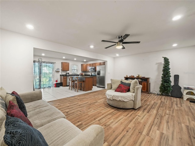 3747 Woodbury Hill Loop, Lakeland, FL 33810 - living room featuring light wood-type flooring, ceiling fan, and recessed lighting