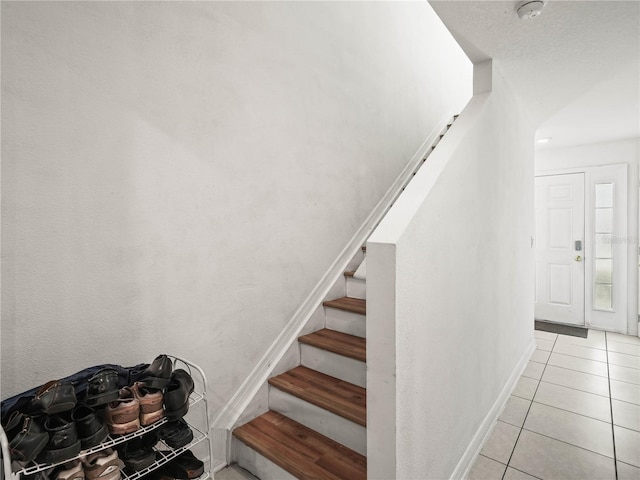 3747 Woodbury Hill Loop, Lakeland, FL 33810 - stairs featuring tile patterned floors and baseboards