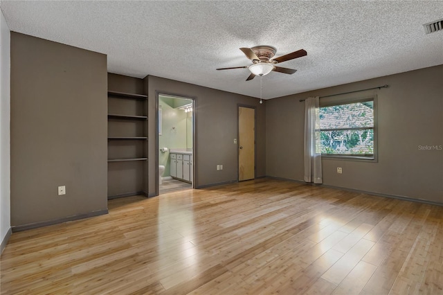3408 Cove Ct W, Winter Haven, FL 33880 - empty room with ceiling fan, a textured ceiling, and light wood finished floors