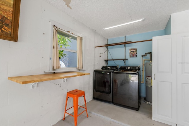 3408 Cove Ct W, Winter Haven, FL 33880 - laundry room featuring separate washer and dryer, a textured ceiling, and electric water heater