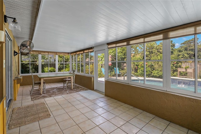 3408 Cove Ct W, Winter Haven, FL 33880 - sunroom featuring tile patterned flooring