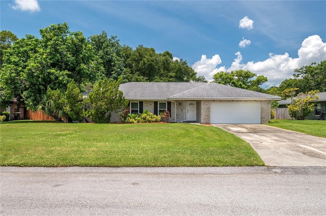305 Hernando Rd, Winter Haven, FL 33884 - ranch-style house featuring driveway, a garage, and brick siding