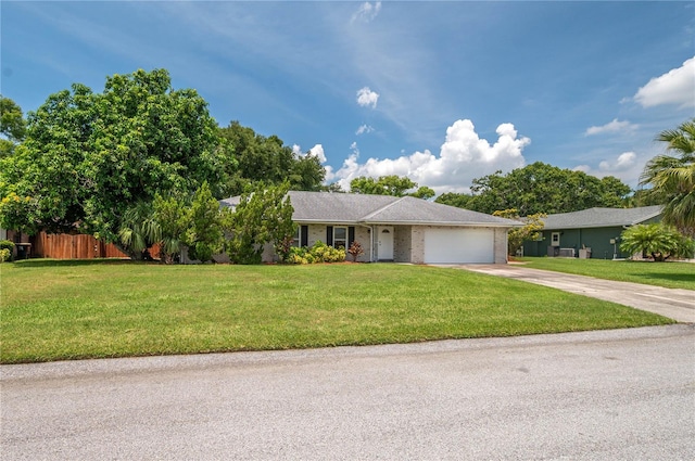 305 Hernando Rd, Winter Haven, FL 33884 - ranch-style home with concrete driveway and an attached garage
