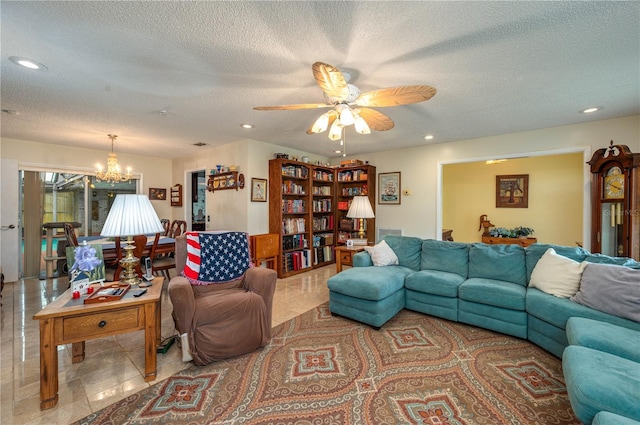 305 Hernando Rd, Winter Haven, FL 33884 - tiled living room featuring a textured ceiling, a chandelier, recessed lighting, and ceiling fan