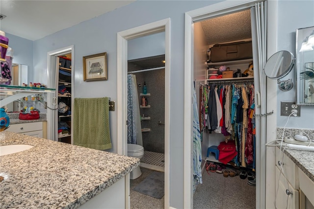 305 Hernando Rd, Winter Haven, FL 33884 - full bathroom featuring vanity, a shower stall, and a spacious closet