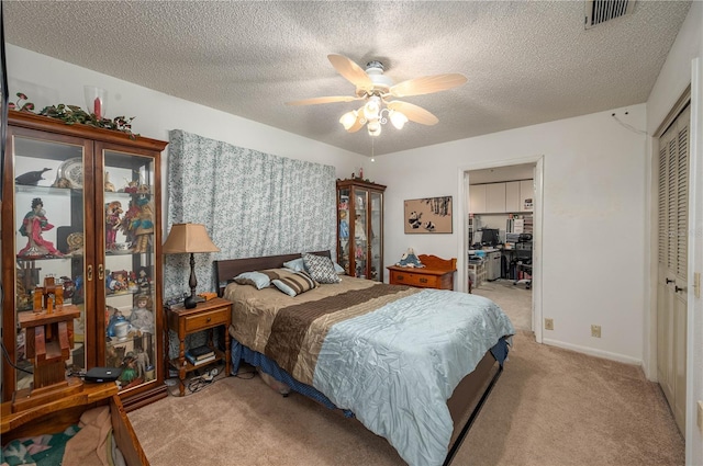 305 Hernando Rd, Winter Haven, FL 33884 - carpeted bedroom with a closet, a textured ceiling, and ceiling fan