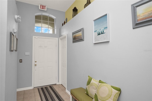 142 Plumoso Loop, Davenport, FL 33897 - entrance foyer featuring light tile patterned flooring and baseboards