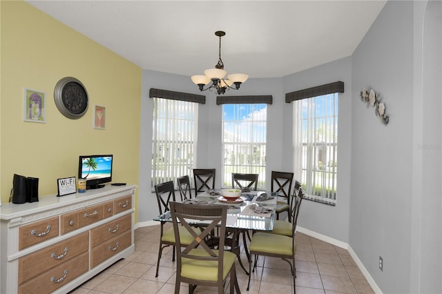 142 Plumoso Loop, Davenport, FL 33897 - dining room with a chandelier and light tile patterned floors