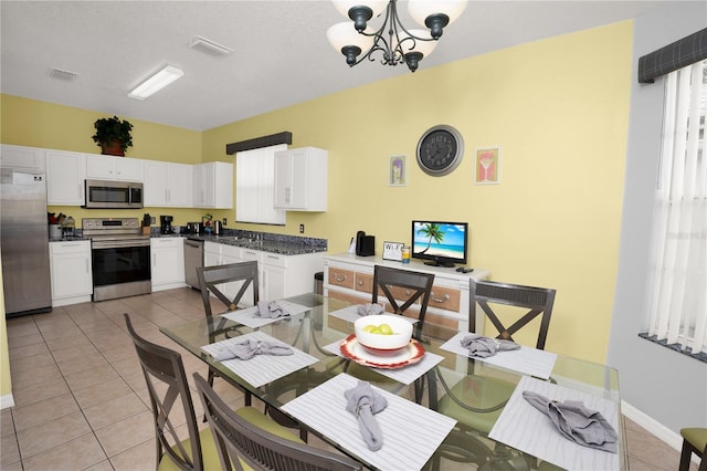 142 Plumoso Loop, Davenport, FL 33897 - dining room featuring light tile patterned flooring and a chandelier