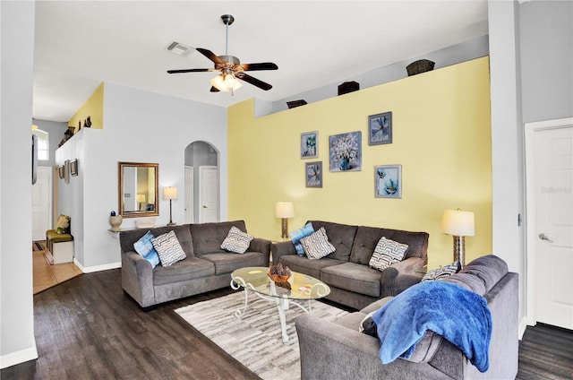 142 Plumoso Loop, Davenport, FL 33897 - living room with arched walkways, ceiling fan, and wood finished floors