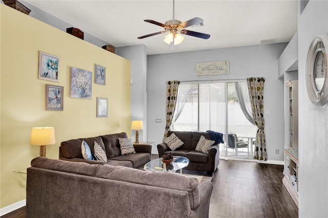 142 Plumoso Loop, Davenport, FL 33897 - living room featuring dark wood-style flooring and a ceiling fan