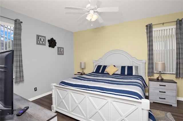142 Plumoso Loop, Davenport, FL 33897 - bedroom featuring dark wood-style floors and ceiling fan