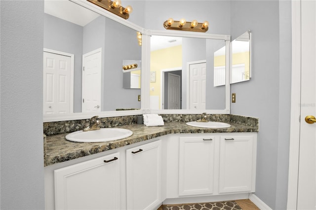 142 Plumoso Loop, Davenport, FL 33897 - full bathroom featuring double vanity and tile patterned floors