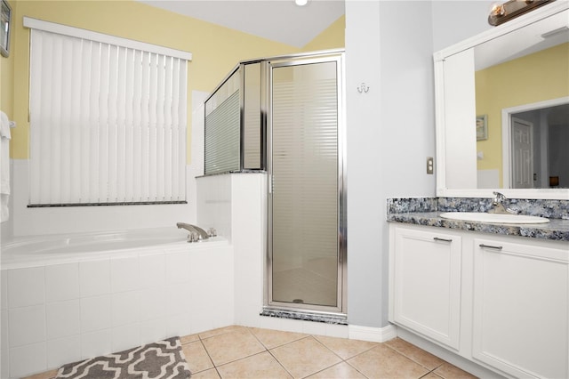 142 Plumoso Loop, Davenport, FL 33897 - full bath featuring vanity, a stall shower, tile patterned floors, and a garden tub