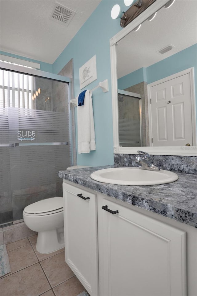 142 Plumoso Loop, Davenport, FL 33897 - full bathroom with vanity, a stall shower, and tile patterned floors