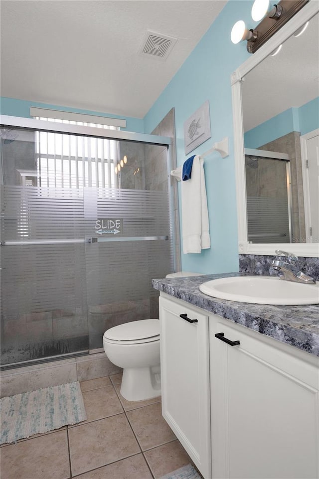 142 Plumoso Loop, Davenport, FL 33897 - bathroom with vanity, a stall shower, and tile patterned floors