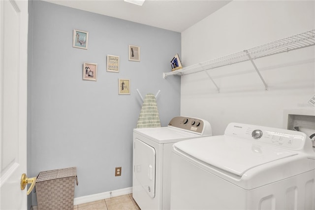 142 Plumoso Loop, Davenport, FL 33897 - laundry room with washing machine and clothes dryer and light tile patterned flooring