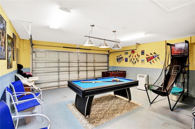 142 Plumoso Loop, Davenport, FL 33897 - rec room with a garage, finished concrete flooring, a textured ceiling, and billiards
