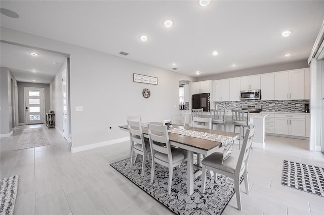 1504 Aspen Ave, Davenport, FL 33837 - dining room with baseboards and recessed lighting