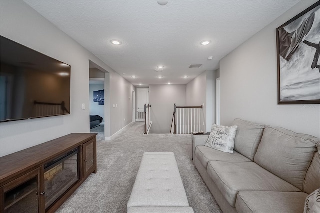 1504 Aspen Ave, Davenport, FL 33837 - living area with carpet floors, recessed lighting, and a textured ceiling