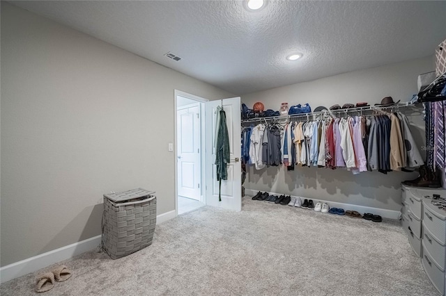 1504 Aspen Ave, Davenport, FL 33837 - walk in closet featuring carpet flooring