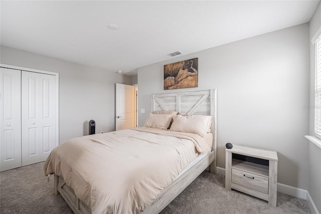1504 Aspen Ave, Davenport, FL 33837 - carpeted bedroom featuring a closet and baseboards