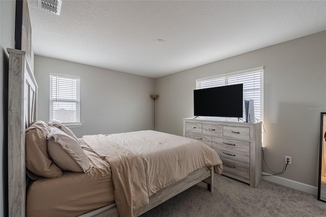 1504 Aspen Ave, Davenport, FL 33837 - bedroom featuring light carpet and baseboards