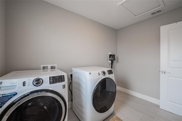 1504 Aspen Ave, Davenport, FL 33837 - laundry room with washing machine and dryer and attic access