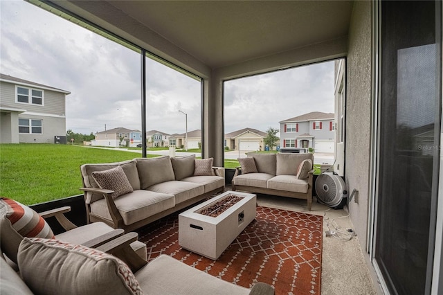 1504 Aspen Ave, Davenport, FL 33837 - sunroom with an outdoor living space with a fire pit and a residential view