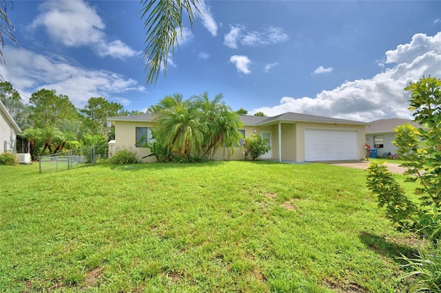 2123 Ramsdale Dr SE, Palm Bay, FL 32909 - view of yard with a garage and driveway