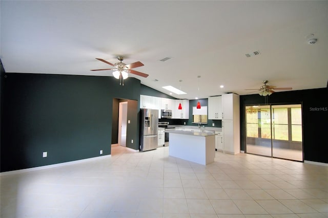 2123 Ramsdale Dr SE, Palm Bay, FL 32909 - kitchen with stainless steel appliances, a ceiling fan, open floor plan, lofted ceiling, and recessed lighting