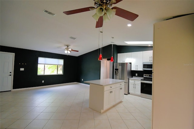 2123 Ramsdale Dr SE, Palm Bay, FL 32909 - kitchen with stainless steel appliances, a ceiling fan, lofted ceiling, open floor plan, and light countertops