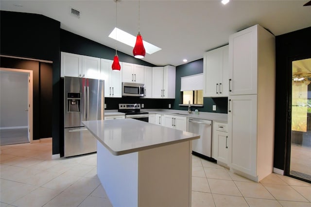 2123 Ramsdale Dr SE, Palm Bay, FL 32909 - kitchen with stainless steel appliances, a skylight, lofted ceiling, hanging light fixtures, and light countertops