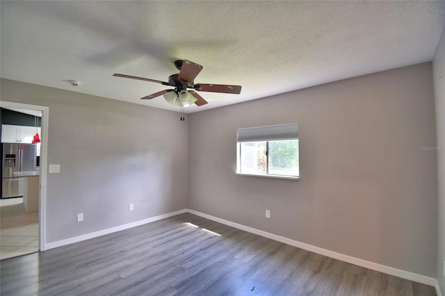 2123 Ramsdale Dr SE, Palm Bay, FL 32909 - spare room featuring a ceiling fan, wood finished floors, a smoke detector, and a textured ceiling