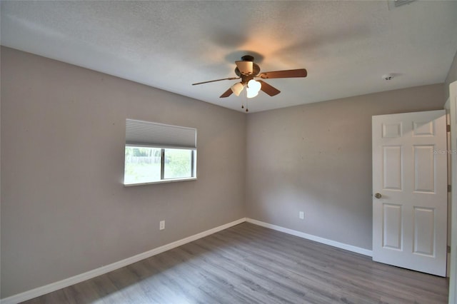 2123 Ramsdale Dr SE, Palm Bay, FL 32909 - unfurnished room featuring ceiling fan, wood finished floors, and a smoke detector
