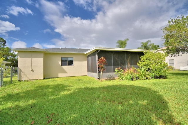 2123 Ramsdale Dr SE, Palm Bay, FL 32909 - back of property with a sunroom and stucco siding