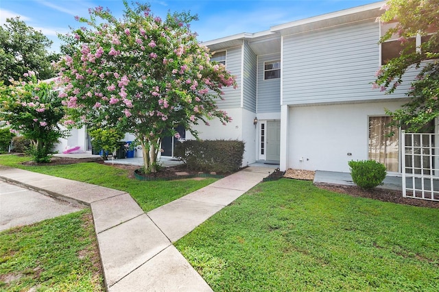 222 Carpenters Way Unit 73, Lakeland, FL 33805 - multi unit property with a front lawn and stucco siding