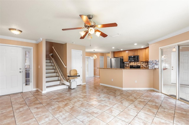 222 Carpenters Way Unit 73, Lakeland, FL 33805 - kitchen with stainless steel appliances, backsplash, a ceiling fan, a peninsula, and recessed lighting