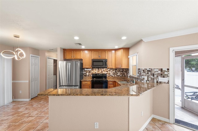 222 Carpenters Way Unit 73, Lakeland, FL 33805 - kitchen featuring freestanding refrigerator, electric range, a peninsula, light stone counters, and recessed lighting