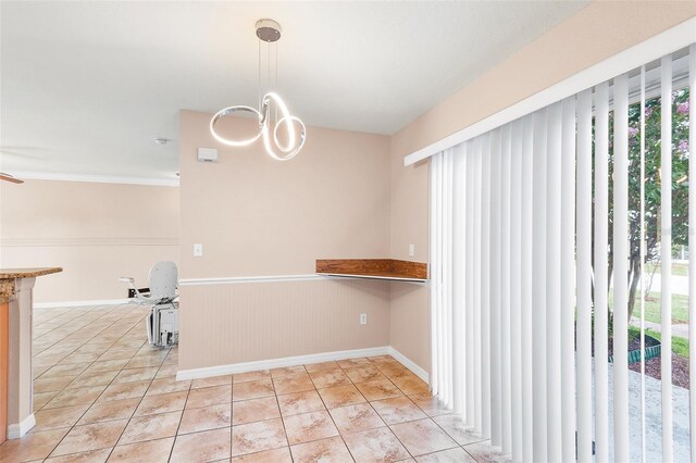 222 Carpenters Way Unit 73, Lakeland, FL 33805 - unfurnished dining area with healthy amount of natural light, wainscoting, and a chandelier