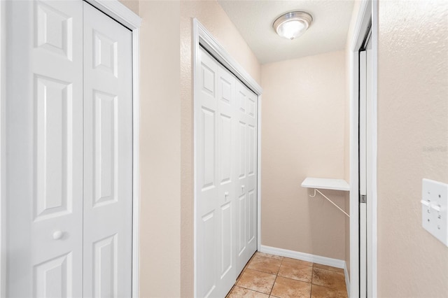 222 Carpenters Way Unit 73, Lakeland, FL 33805 - corridor with light tile patterned floors and baseboards