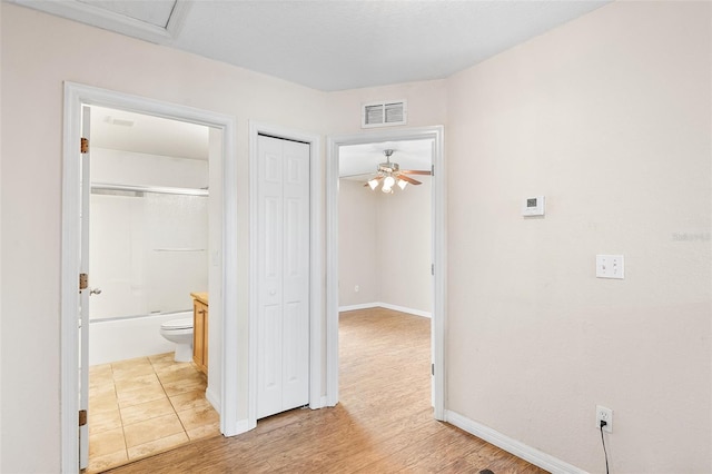 222 Carpenters Way Unit 73, Lakeland, FL 33805 - corridor featuring baseboards and light wood-style floors