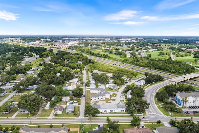 222 Carpenters Way Unit 73, Lakeland, FL 33805 - aerial perspective of suburban area featuring a major roadway and a tree filled landscape