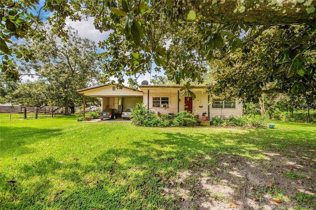 4430 1st St NW, Lakeland, FL 33810 - view of front facade with a carport